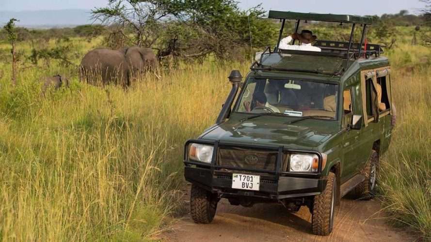 4x4 safari landcruiser jeep at Serengeti Migration Camp Tanzania scaled