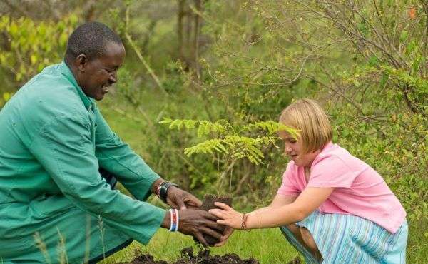 Tree planting on African safari Basecamp Masai Mara Kenya