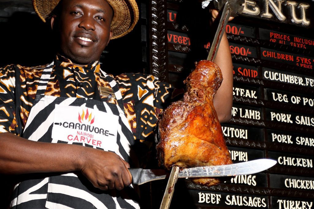 Serving Kenyan food at the Carnivore Restaurant in Nairobi